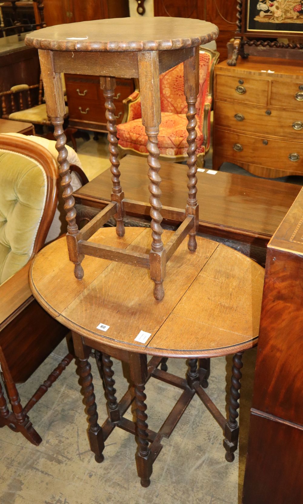A 1920s oak shaped circular topped occasional table, W.50cm and a gateleg table, W.60cm